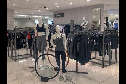 Some of the more eye-catching merchandising, such as these mannequins with wooden hoops, could lure shoppers in. But it is few and far between.